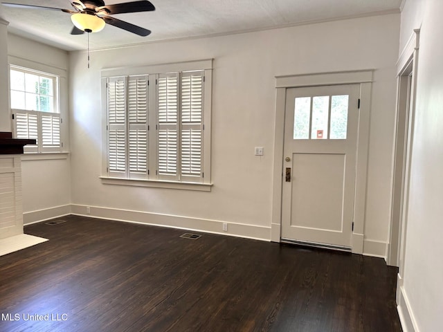 902 Washington St, Natchez, MS 39120 - foyer entrance featuring a ceiling fan and dark wood-style floors