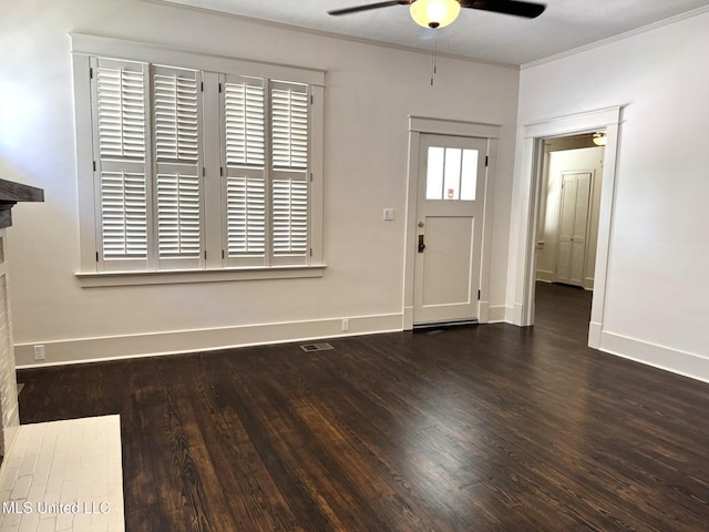 902 Washington St, Natchez, MS 39120 - entrance foyer featuring a ceiling fan, wood finished floors, and ornamental molding