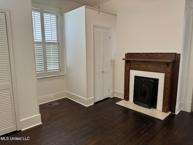 902 Washington St, Natchez, MS 39120 - unfurnished living room with wood finished floors and baseboards