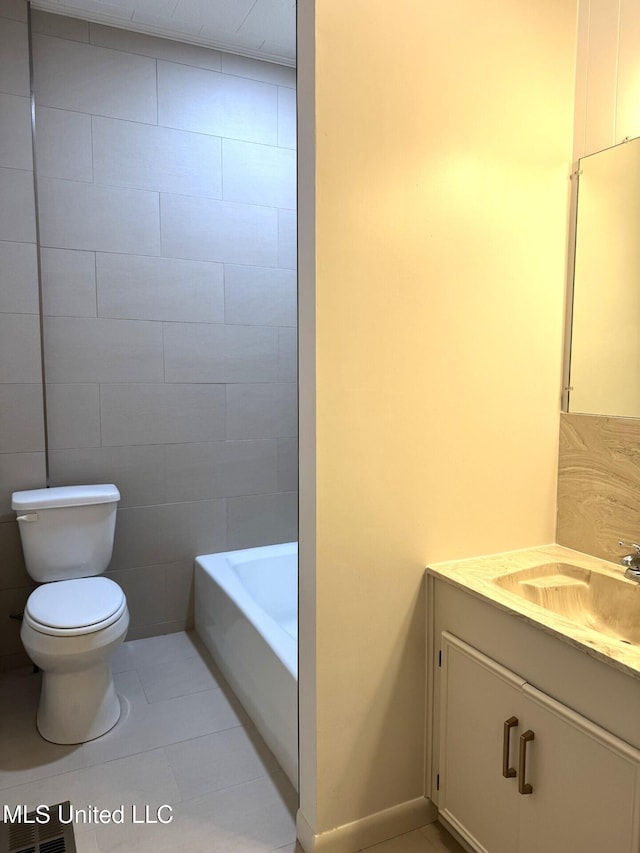 902 Washington St, Natchez, MS 39120 - full bath featuring vanity, a bathtub, and tile patterned floors