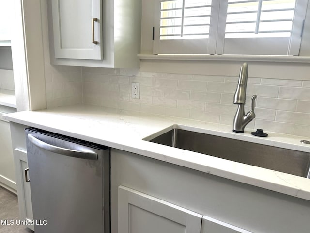 902 Washington St, Natchez, MS 39120 - kitchen with dishwasher, tasteful backsplash, light stone countertops, and gray cabinets