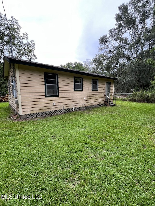 exterior space with a lawn