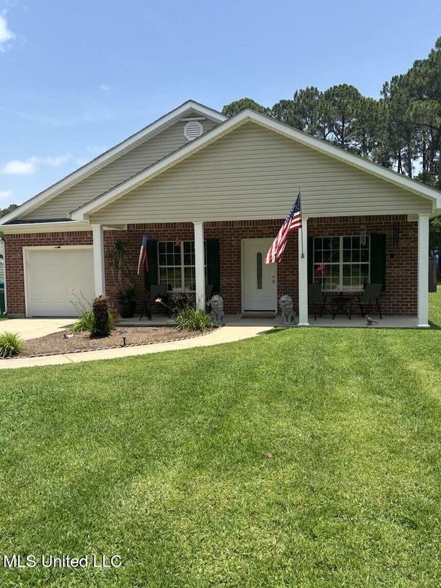 1720 Barracuda Dr, Gautier, MS 39553 - view of front of home with an attached garage, a front yard, brick siding, and concrete driveway