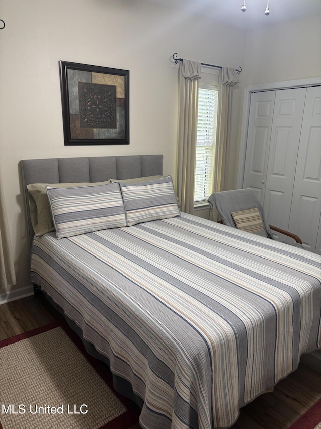 1720 Barracuda Dr, Gautier, MS 39553 - bedroom featuring wood finished floors and a closet