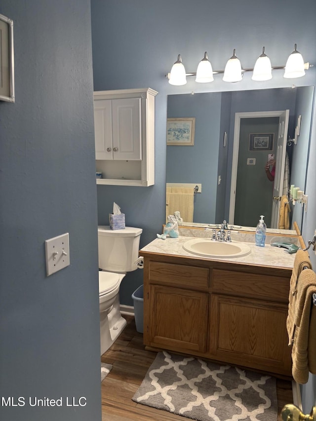 1720 Barracuda Dr, Gautier, MS 39553 - bathroom featuring toilet, wood finished floors, and vanity