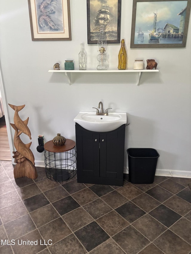 1720 Barracuda Dr, Gautier, MS 39553 - bathroom with vanity, baseboards, and tile patterned flooring