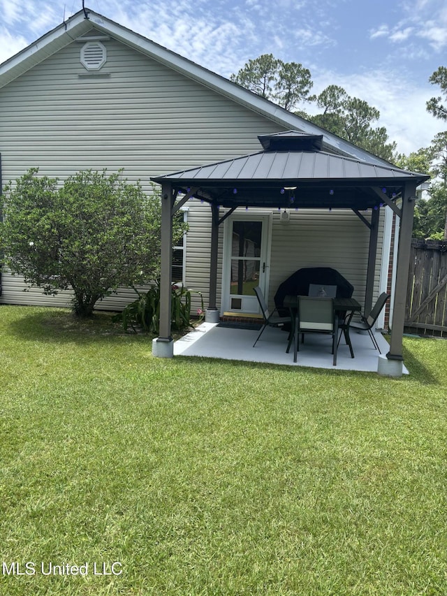 1720 Barracuda Dr, Gautier, MS 39553 - rear view of house featuring a gazebo, a patio, and a standing seam roof