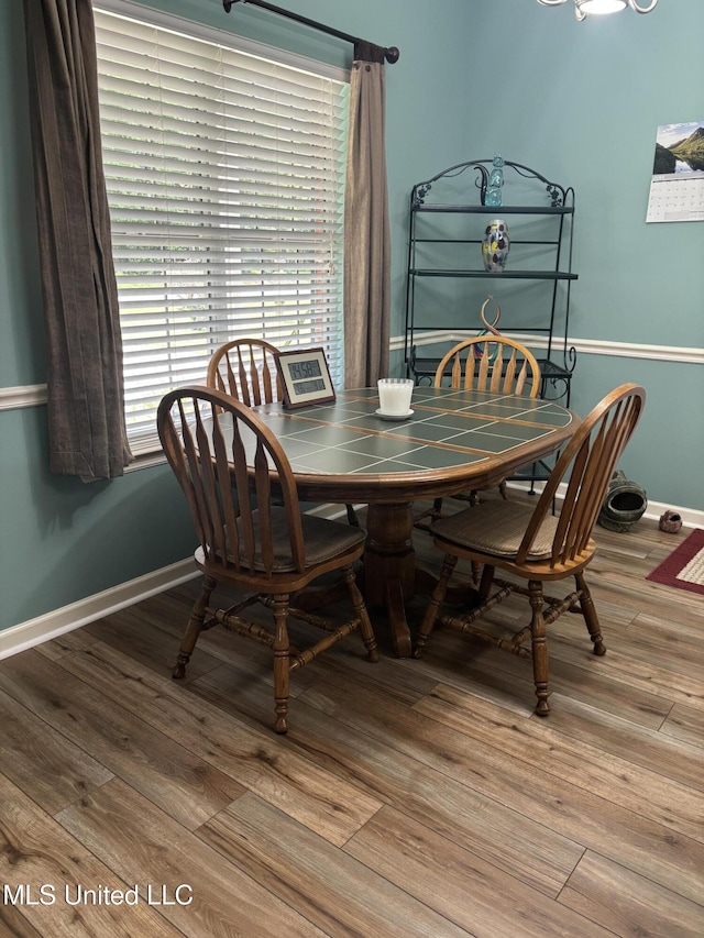 1720 Barracuda Dr, Gautier, MS 39553 - dining area featuring wood finished floors and baseboards