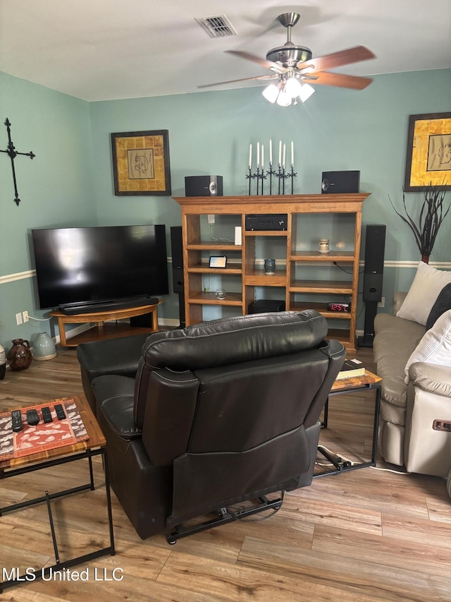 1720 Barracuda Dr, Gautier, MS 39553 - living area with wood finished floors and a ceiling fan