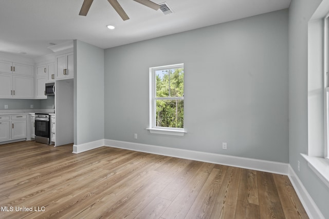 417 4th Ave, Pass Christian, MS 39571 - unfurnished living room featuring ceiling fan, light wood-style flooring, and recessed lighting