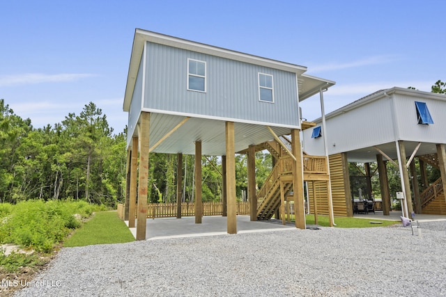 417 4th Ave, Pass Christian, MS 39571 - surrounding community featuring stairs, a patio area, and a carport