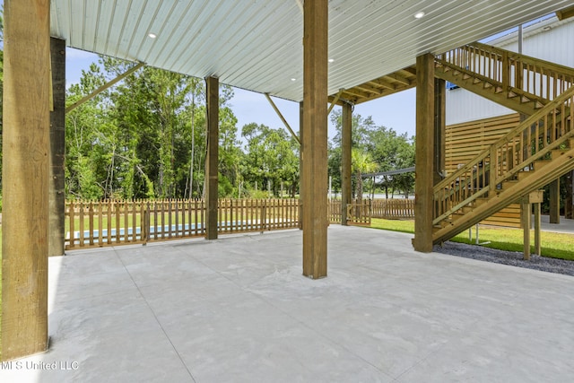 417 4th Ave, Pass Christian, MS 39571 - view of patio featuring stairway and view of scattered trees