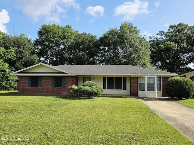 2501 Woolmarket St, Gulfport, MS 39503 - ranch-style home featuring a front lawn, brick siding, and concrete driveway