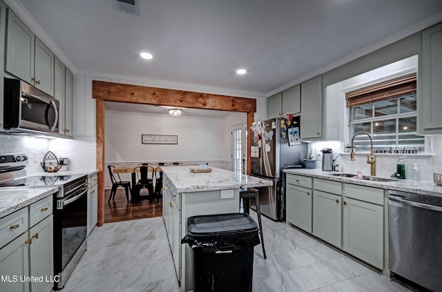 215 Moss Valley Dr, Brandon, MS 39042 - kitchen featuring stainless steel appliances, light marble finish floors, light stone countertops, backsplash, and recessed lighting