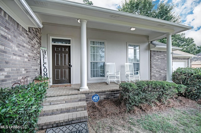 215 Moss Valley Dr, Brandon, MS 39042 - view of exterior entry with covered porch and brick siding