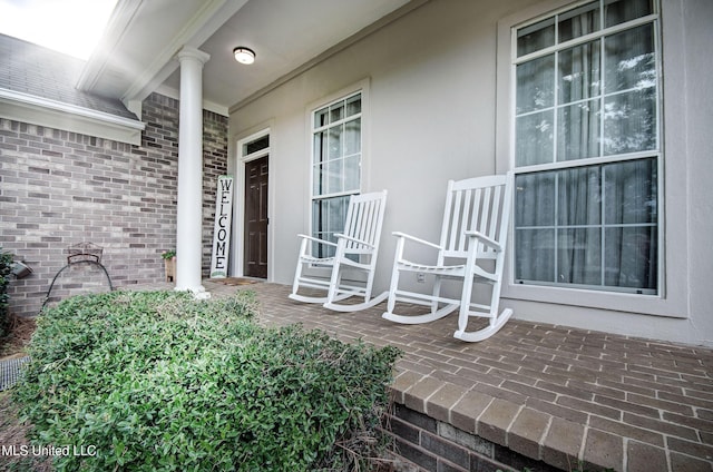 215 Moss Valley Dr, Brandon, MS 39042 - entrance to property with covered porch, brick siding, and stucco siding