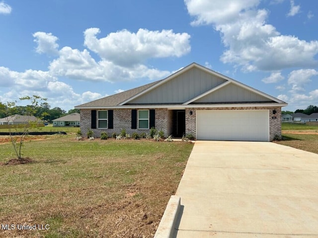 view of front of property featuring a garage and a front lawn