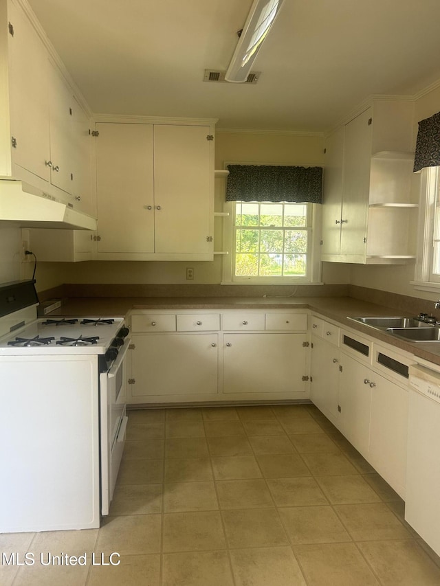 501 W Jefferson Ave, Greenwood, MS 38930 - kitchen with white appliances, open shelves, under cabinet range hood, and a wealth of natural light