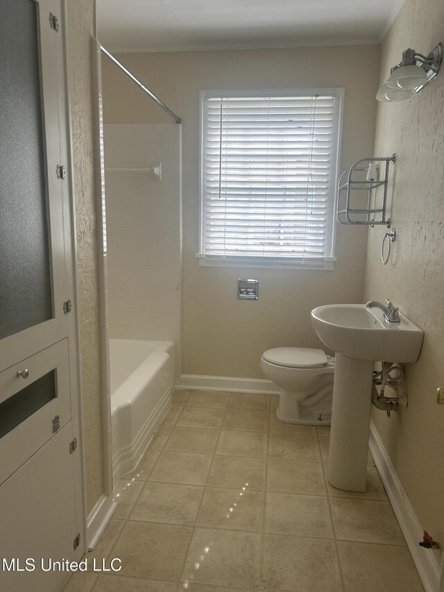 501 W Jefferson Ave, Greenwood, MS 38930 - full bathroom featuring crown molding, shower / tub combination, tile patterned floors, and toilet