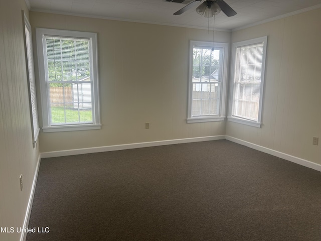 501 W Jefferson Ave, Greenwood, MS 38930 - empty room featuring crown molding, baseboards, and dark carpet