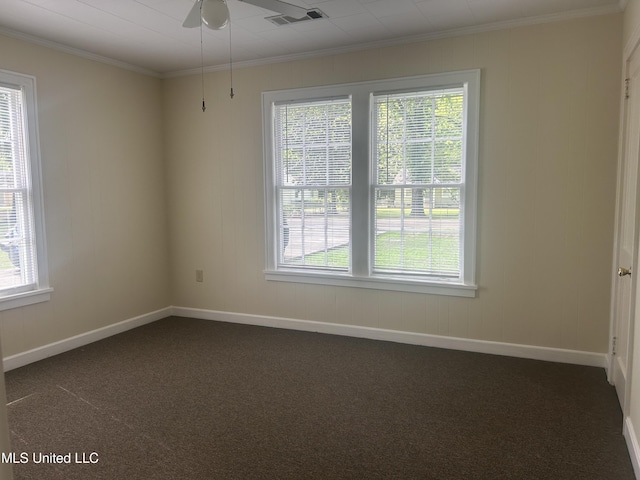 501 W Jefferson Ave, Greenwood, MS 38930 - empty room featuring ornamental molding, dark colored carpet, and visible vents