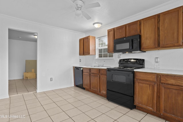 kitchen with black appliances, sink, ceiling fan, light tile patterned floors, and crown molding