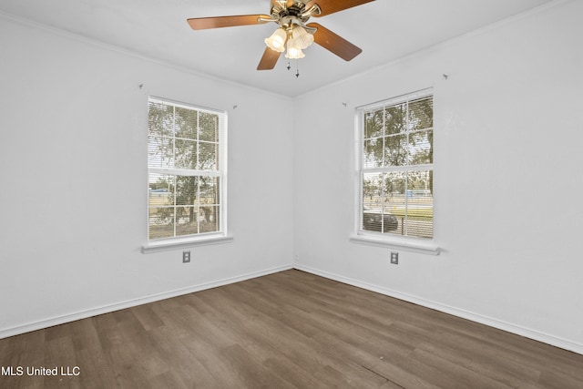 empty room with ceiling fan, crown molding, and hardwood / wood-style flooring