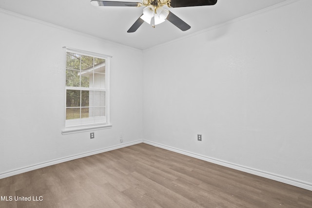 spare room with light wood-type flooring, ceiling fan, and crown molding