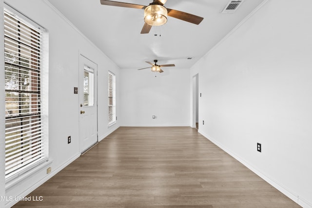 interior space featuring light hardwood / wood-style floors and ornamental molding