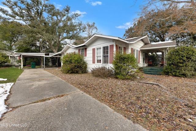 view of side of property with a carport