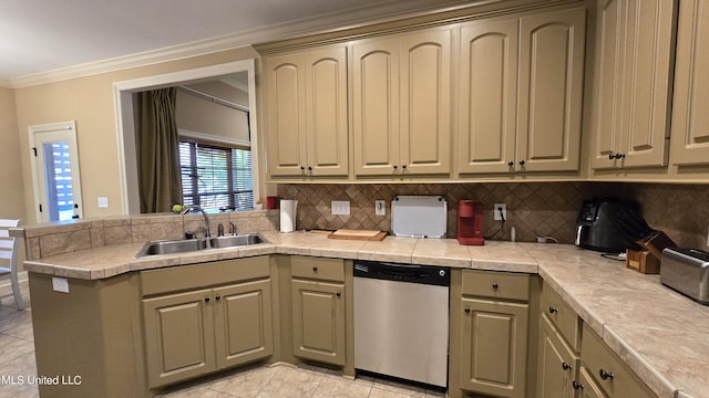 kitchen featuring sink, tile countertops, kitchen peninsula, stainless steel dishwasher, and crown molding