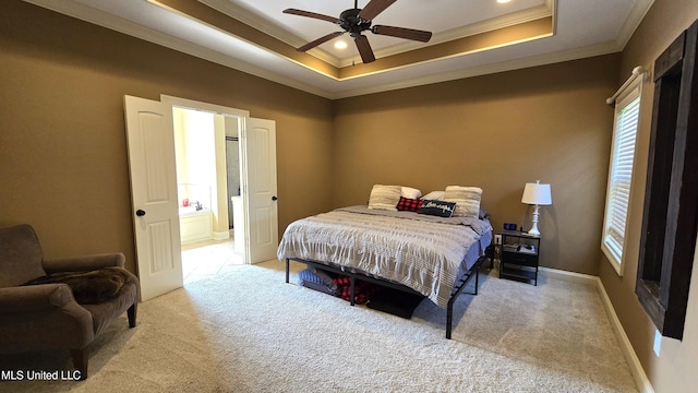 bedroom with ceiling fan, light carpet, ornamental molding, and a raised ceiling