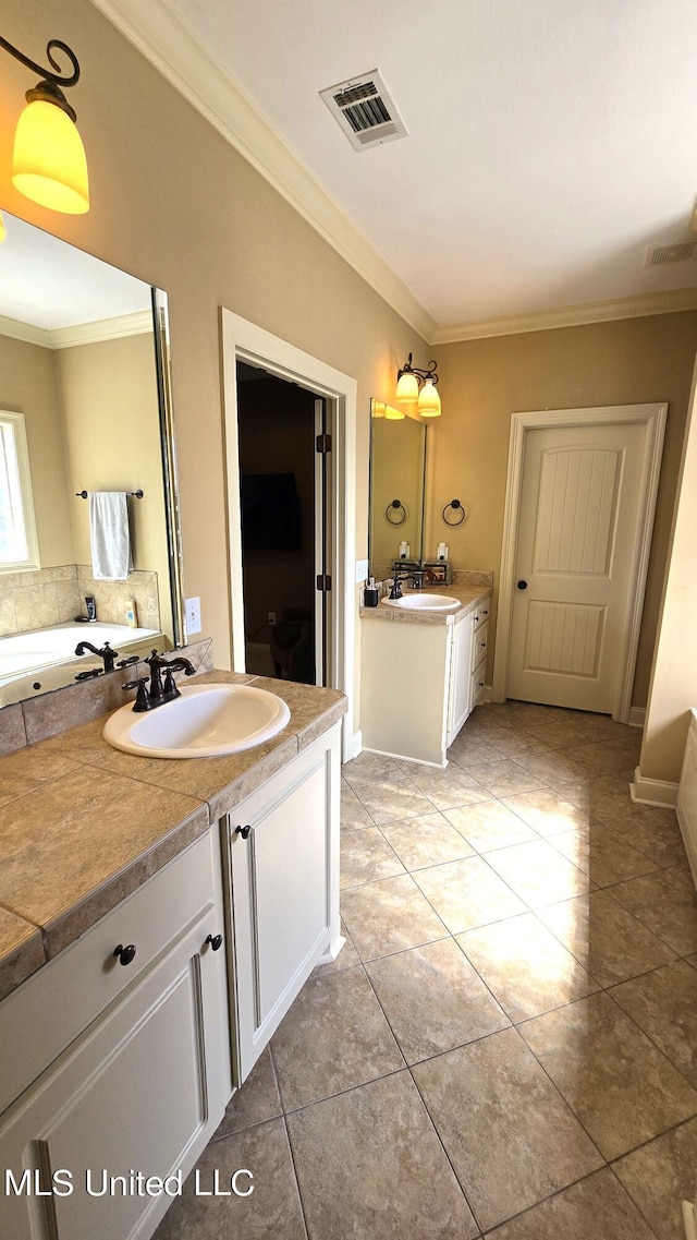 bathroom featuring vanity, crown molding, and tile patterned floors