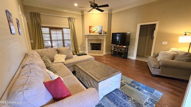 living room with crown molding, ceiling fan, and dark hardwood / wood-style flooring