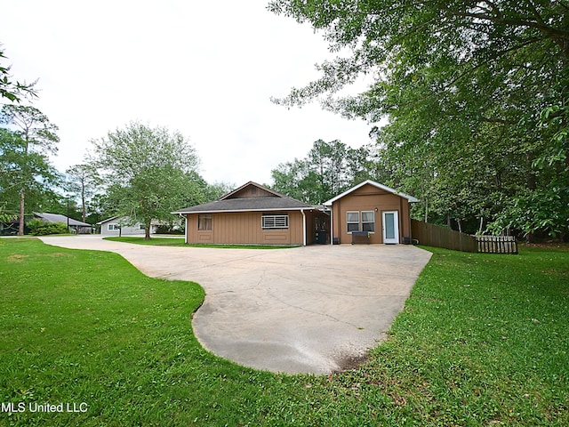single story home featuring concrete driveway