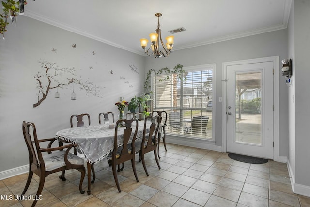 dining room featuring crown molding, a notable chandelier, and visible vents