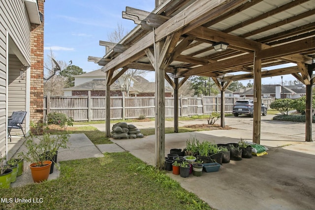 view of patio / terrace featuring fence