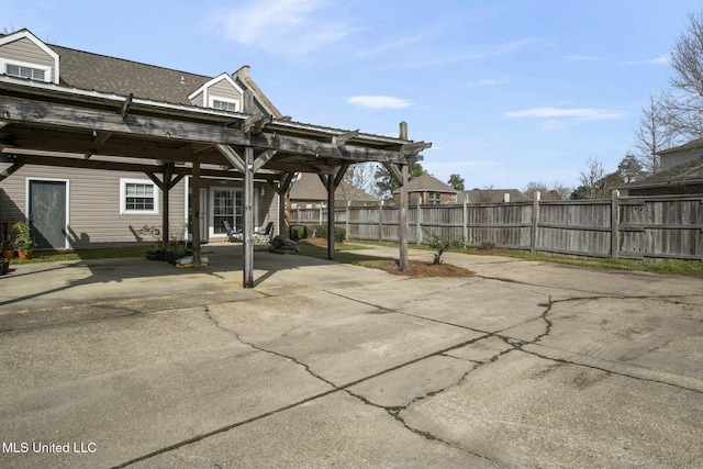 back of house featuring fence