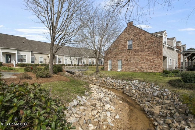 exterior space with brick siding