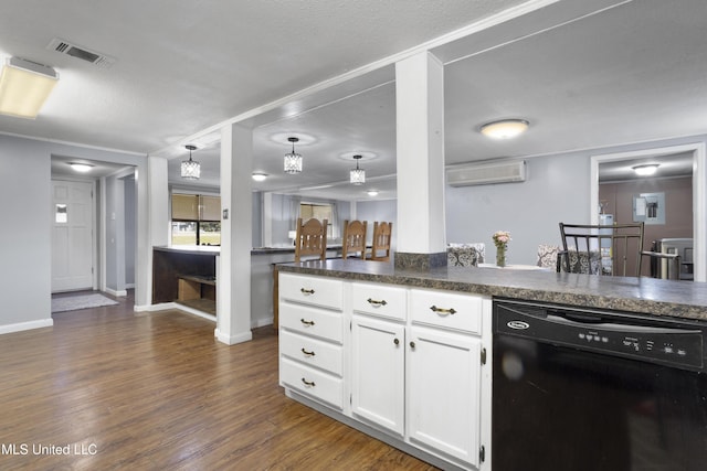 kitchen featuring hanging light fixtures, an AC wall unit, dark hardwood / wood-style flooring, dishwasher, and white cabinets