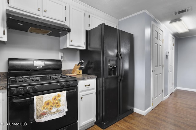 kitchen featuring white cabinetry, dark wood-type flooring, crown molding, and black appliances