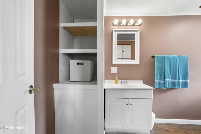 bathroom featuring hardwood / wood-style flooring and vanity