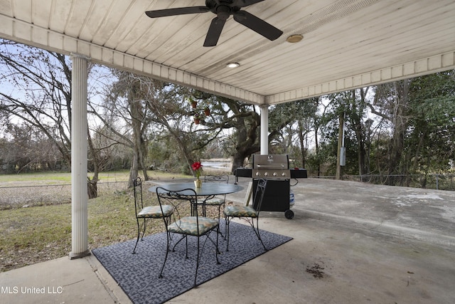 view of patio with area for grilling and ceiling fan