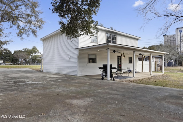 view of front facade featuring a patio and ceiling fan