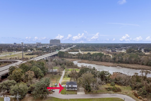 birds eye view of property with a water view