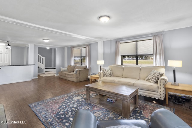 living room with a healthy amount of sunlight and dark hardwood / wood-style floors