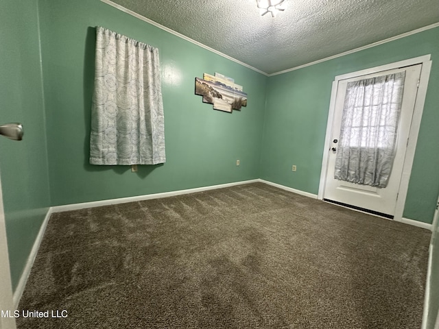 carpeted empty room featuring a textured ceiling