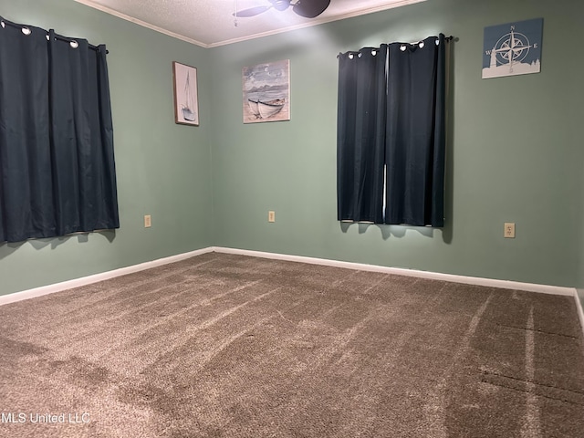 unfurnished room featuring ceiling fan, a textured ceiling, carpet, and ornamental molding