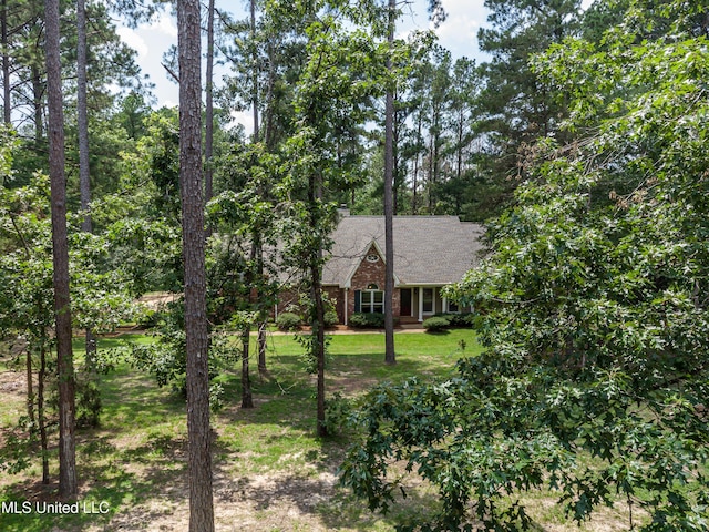 209 Lake Terrace Pl, Brandon, MS 39047 - view of front of home with a shingled roof, a front yard, and brick siding