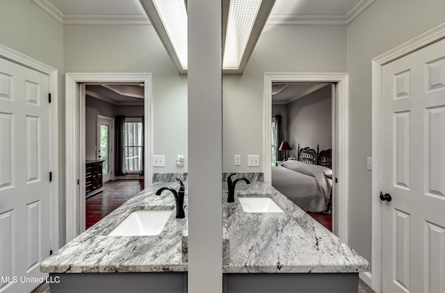 209 Lake Terrace Pl, Brandon, MS 39047 - ensuite bathroom featuring crown molding, double vanity, and wood finished floors